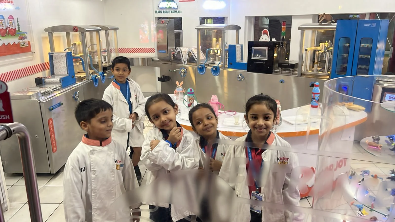 Young children learning with alphabet blocks in a classroom.